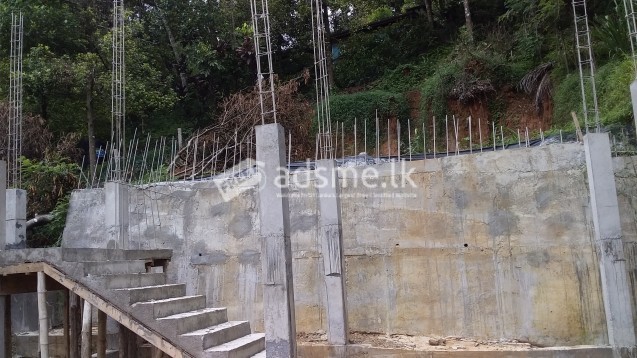 A developed land with ground floor concrete frame work for sale.