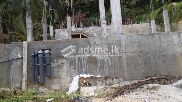 A developed land with ground floor concrete frame work for sale.