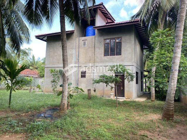 Two story house with land for sale.