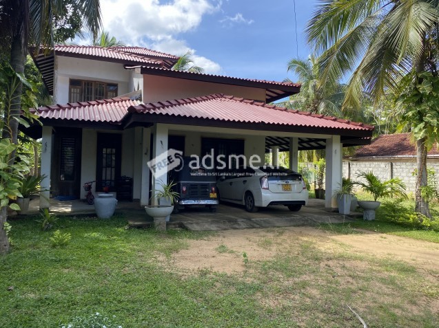 Two story house with land for sale.