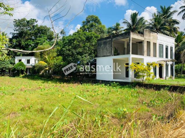 Two story house and two story building with outdoor reception hall for sale.