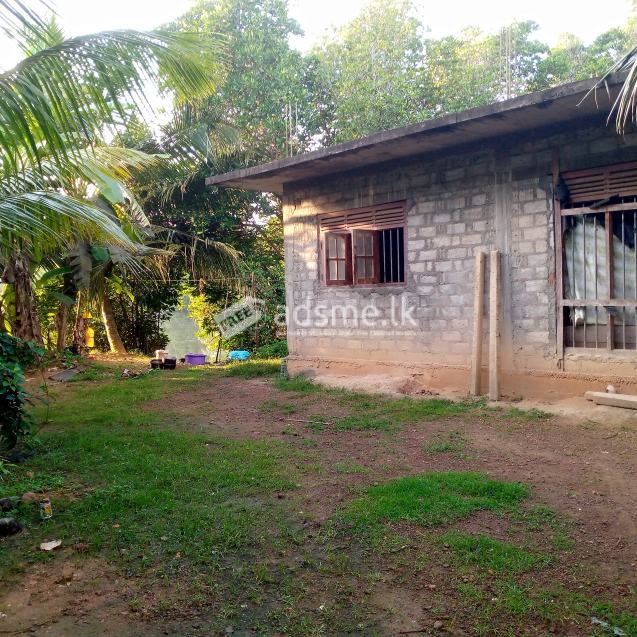 Lake front land for sale with half built house