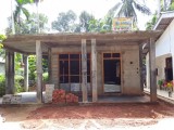 Land with house under construction for sale